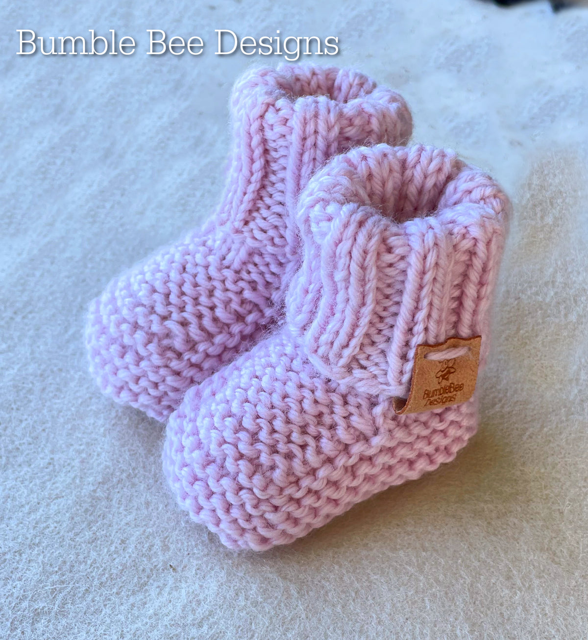 Hand Knitted Top Knot Hat and Matching Booties, Pastel Pink, Sizes 0-12 months