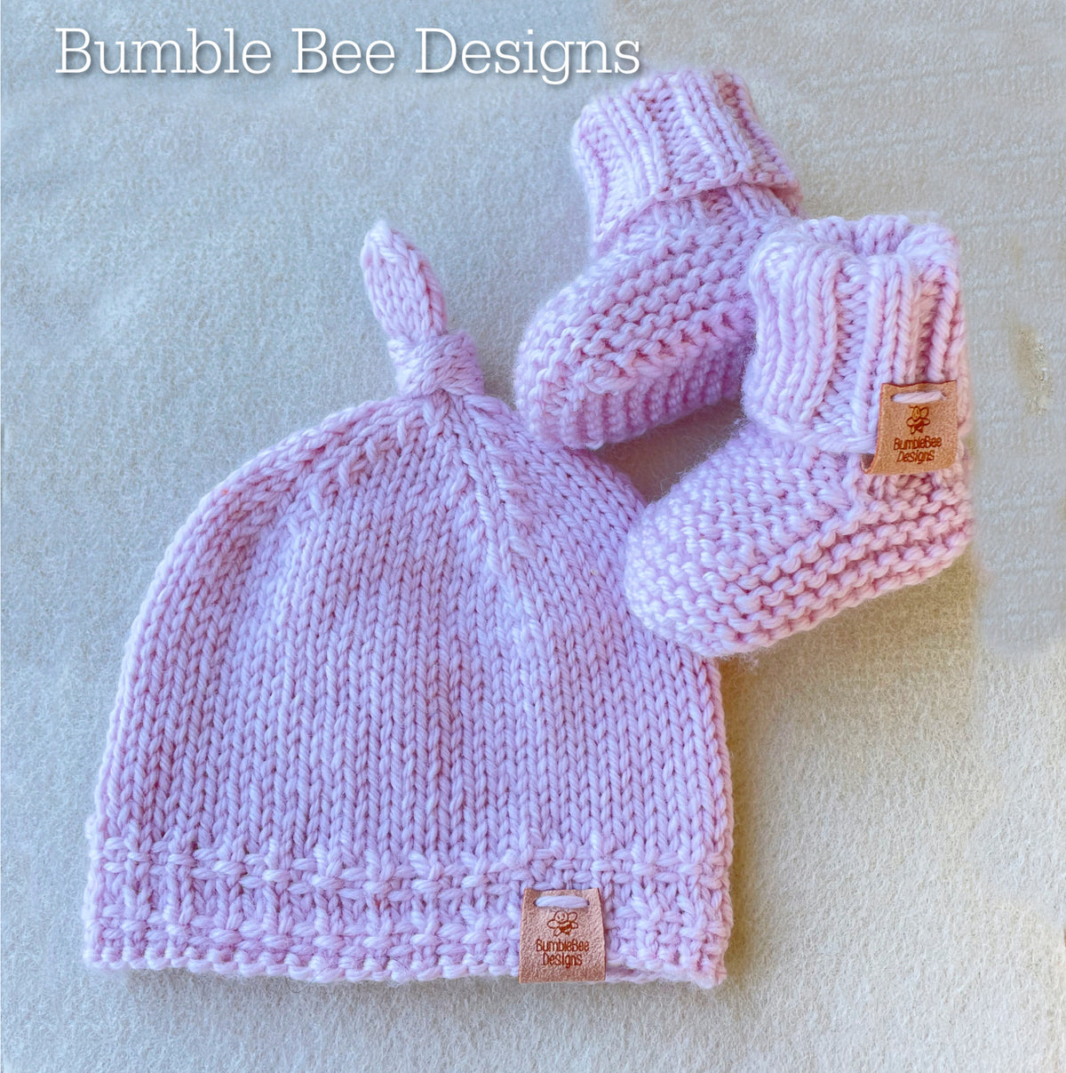 Hand Knitted Top Knot Hat and Matching Booties, Pastel Pink, Sizes 0-12 months