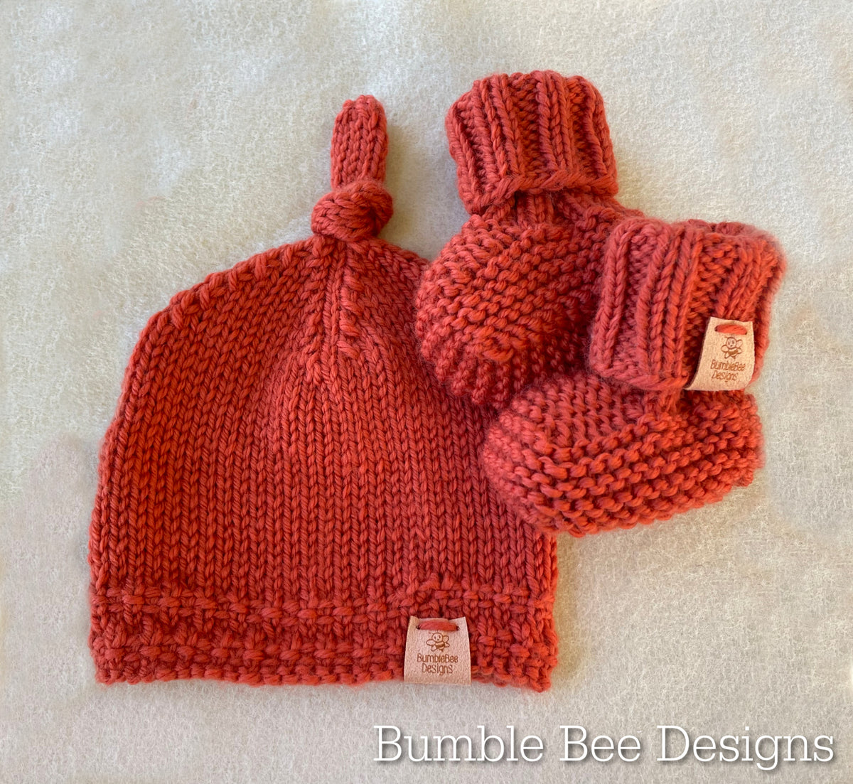 Hand Knitted Top Knot Hat and Matching Booties, Burnt orange