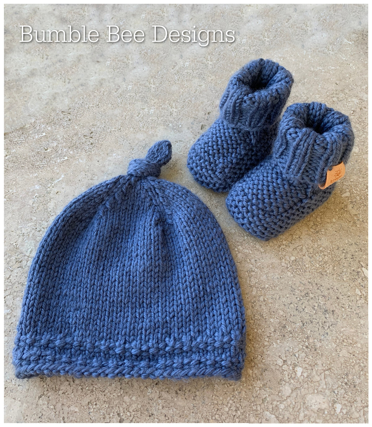 hand knitted top knot hat and matching booties, denim colour, sizes 0-12 months. softest australian merino wool, stay on booties